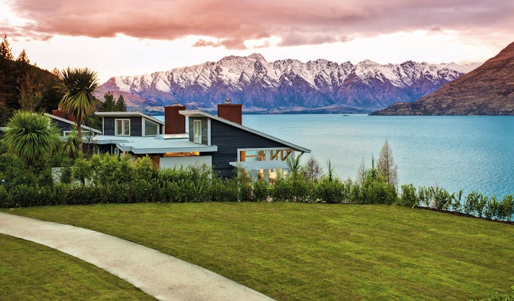 Matakauri Lodge Otago and Fiordland exterior lake wooden chalet with mountain and lake view 