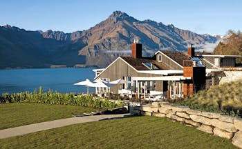 Matakauri Lodge Otago and Fiordland exterior wooden chalet with garden and mountain view