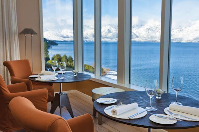 Matakauri Lodge Otago and Fiordland lower lounge dining area with lake and snowy mountain view