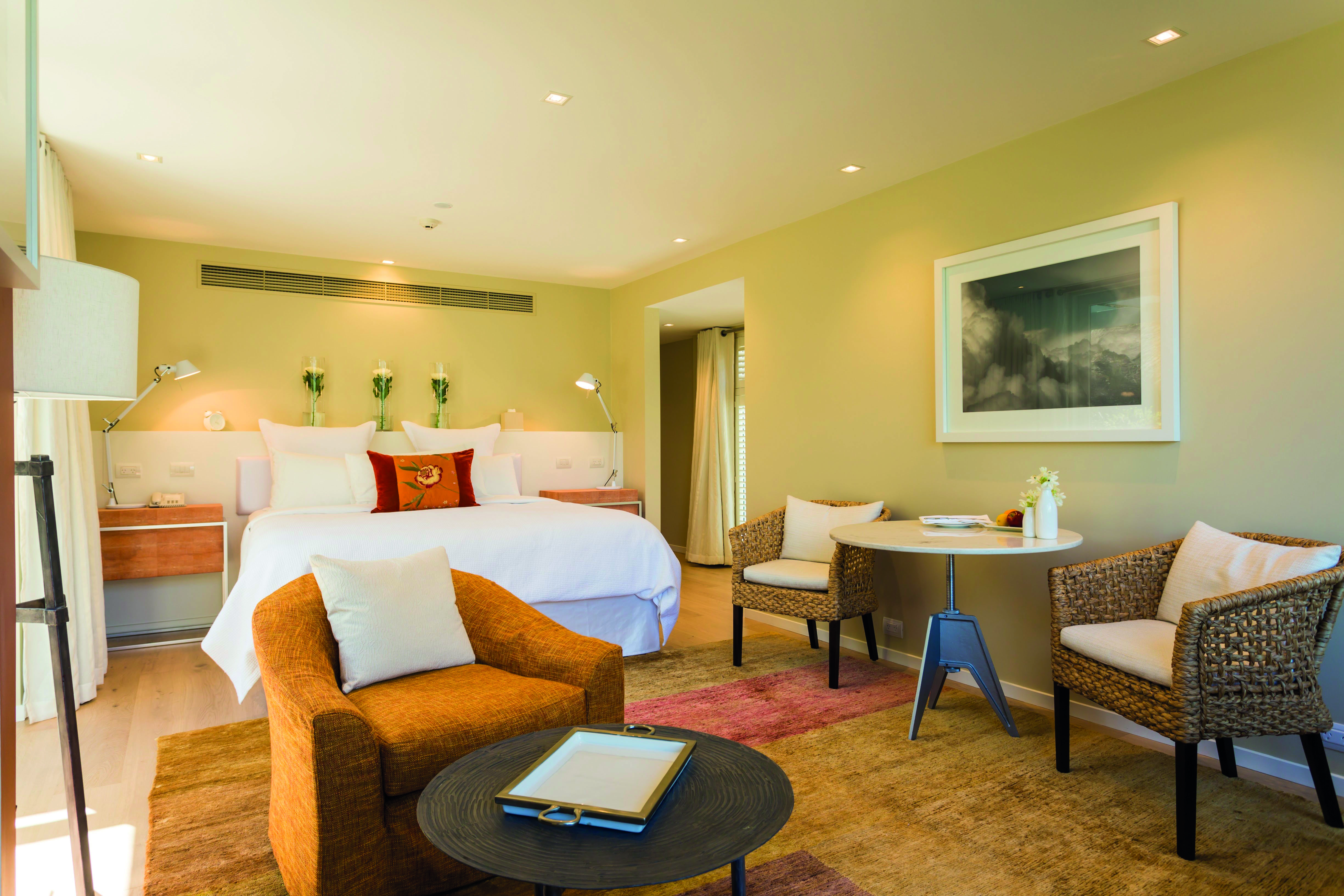 Matakauri Lodge Otago and Fiordland suite bedroom with seating area