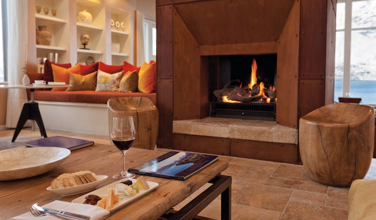 Matakauri Lodge Otago and Fiordland upper lounge area with sofa fireplace and mountain view