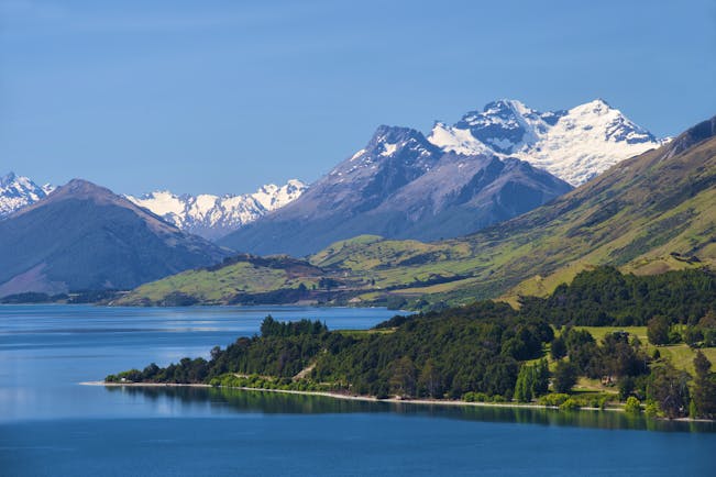 Lake Wakatipu near Queenstown, rugged mountains, snow capped mountain in background