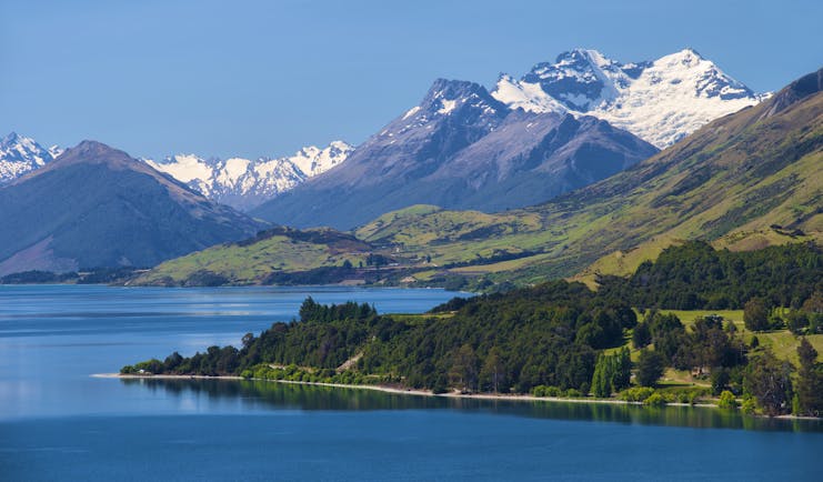 Lake Wakatipu near Queenstown, rugged mountains, snow capped mountain in background