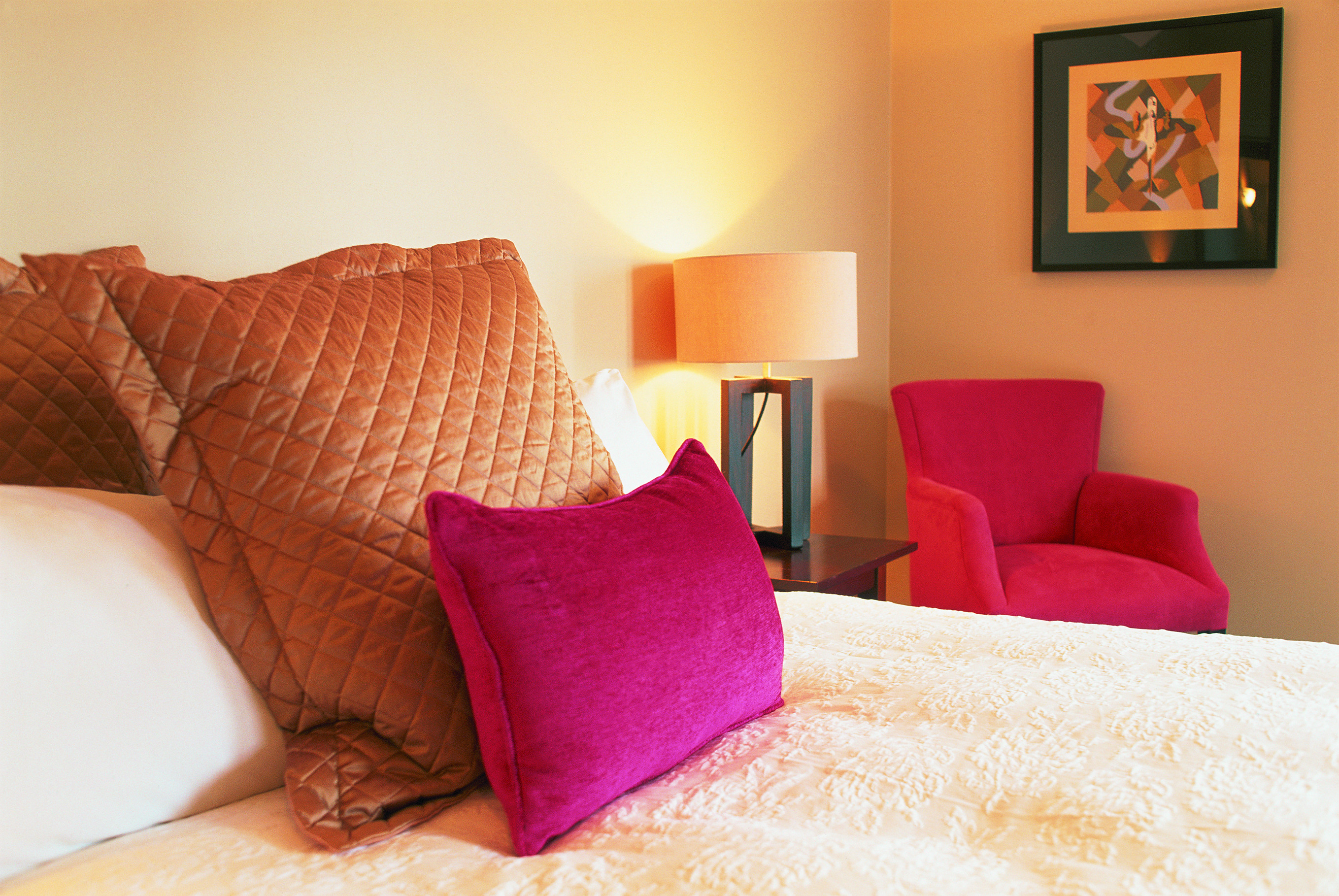 Bedroom at The Dairy with a cream and pink colour scheme
