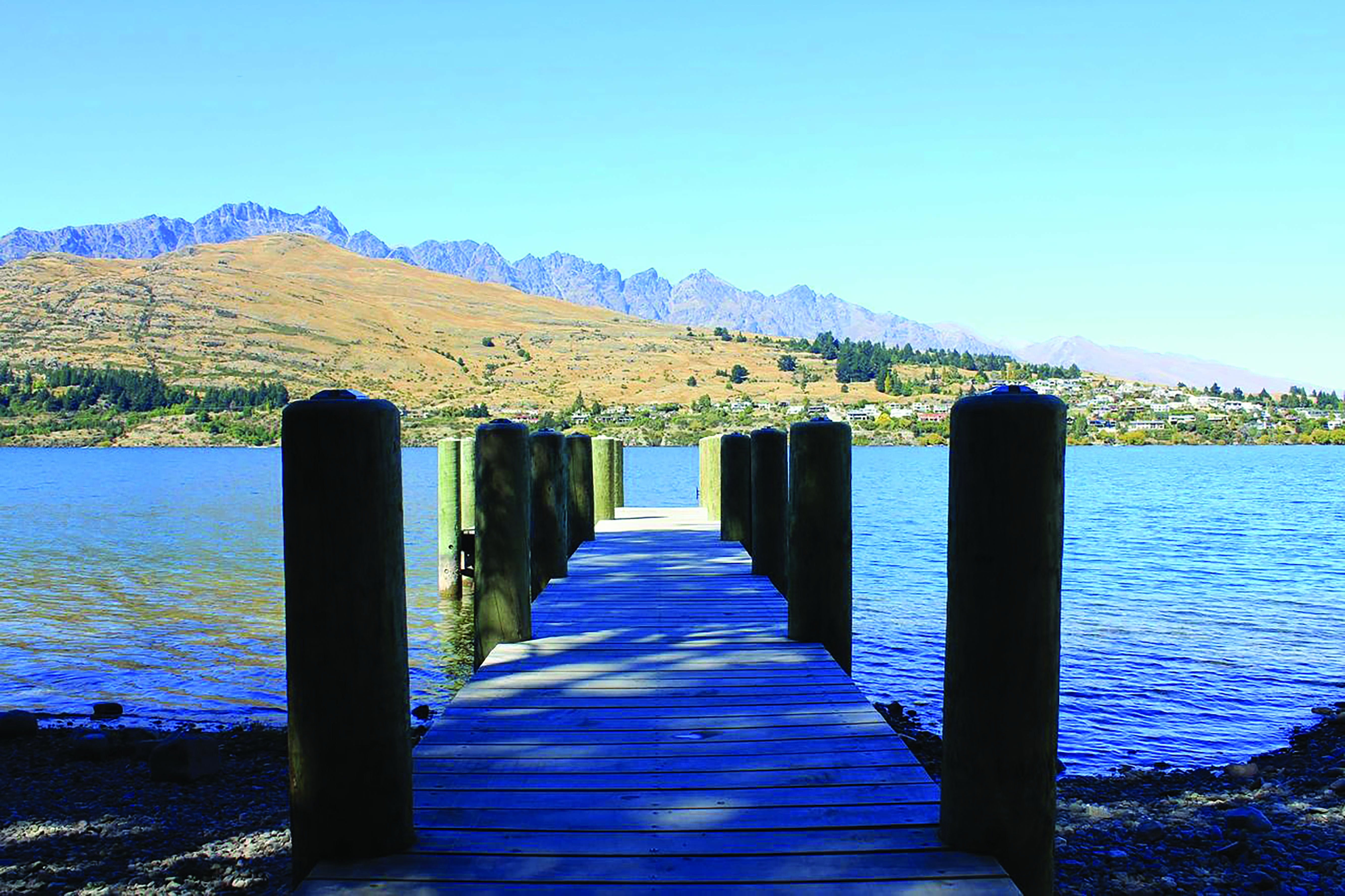 The Rees Hotel Otago and Fiordland  pier into lake with mountain view