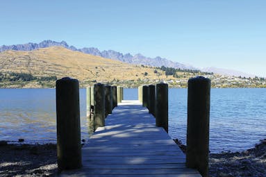 The Rees Hotel Otago and Fiordland  pier into lake with mountain view