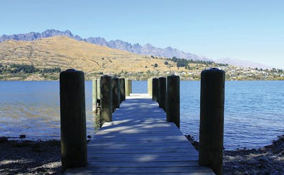 The Rees Hotel Otago and Fiordland  pier into lake with mountain view
