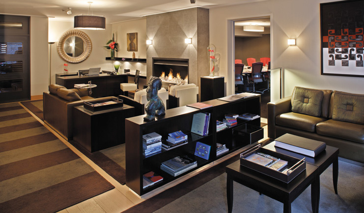 The Spire Otago and Fiordland lounge with sitting area fireplace and bookshelves