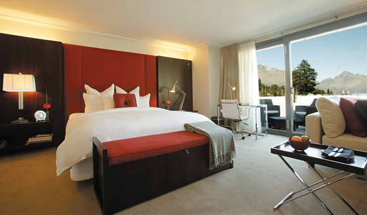 The Spire Otago and Fiordland suite with bed sitting area and patio doors to terrace