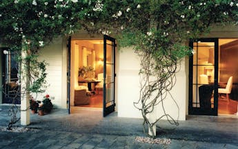 Martinborough Hotel courtyard with foliage and access to lounge