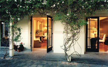 Martinborough Hotel courtyard with foliage and access to lounge