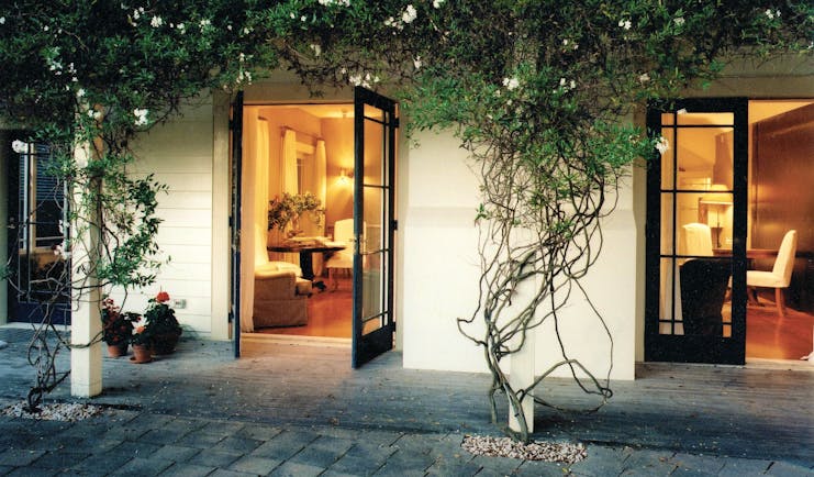 Martinborough Hotel courtyard with foliage and access to lounge