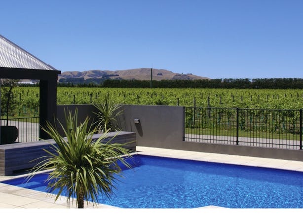 Peppers Parehua Wairarapa outdoor pool with vineyard and mountain view