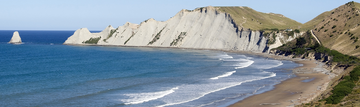White cliffs bordering blue sea and beach