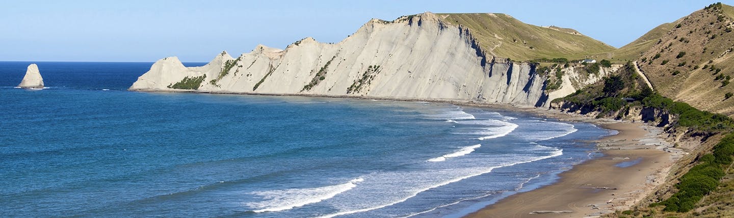 White cliffs bordering blue sea and beach
