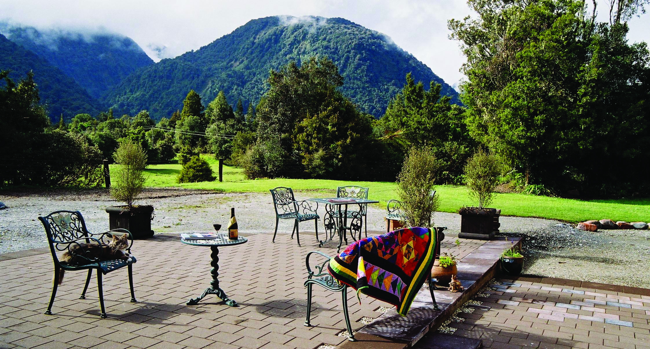 Westwood Country House patio, outdoor seating area, metal chairs, views of gardens, m