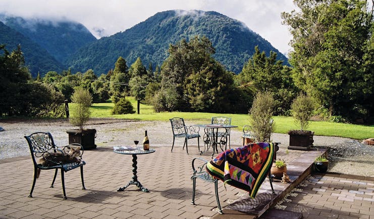 Westwood Country House patio, outdoor seating area, metal chairs, views of gardens, m