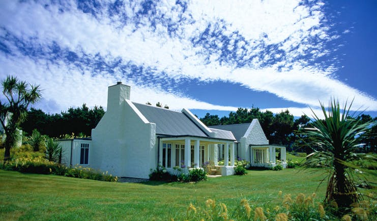 Wharekauhau Lodge Wairarapa cottage with columns and garden