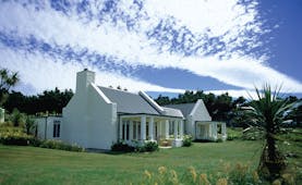 Wharekauhau Lodge Wairarapa cottage with columns and garden