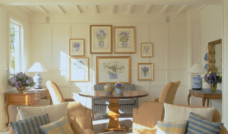 Wharekauhau Lodge Wairarapa drawing room with sofas and pictures on the walls