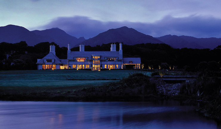 Wharekauhau Lodge Wairarapa mountain evening exterior view of lodge at night time in front of mountains