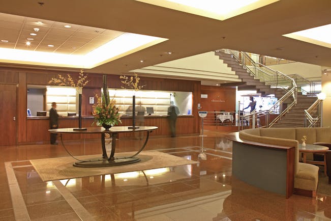 The Intercontinental Wellington lobby area with reception desk seating area and staircase