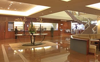 The Intercontinental Wellington lobby area with reception desk seating area and staircase
