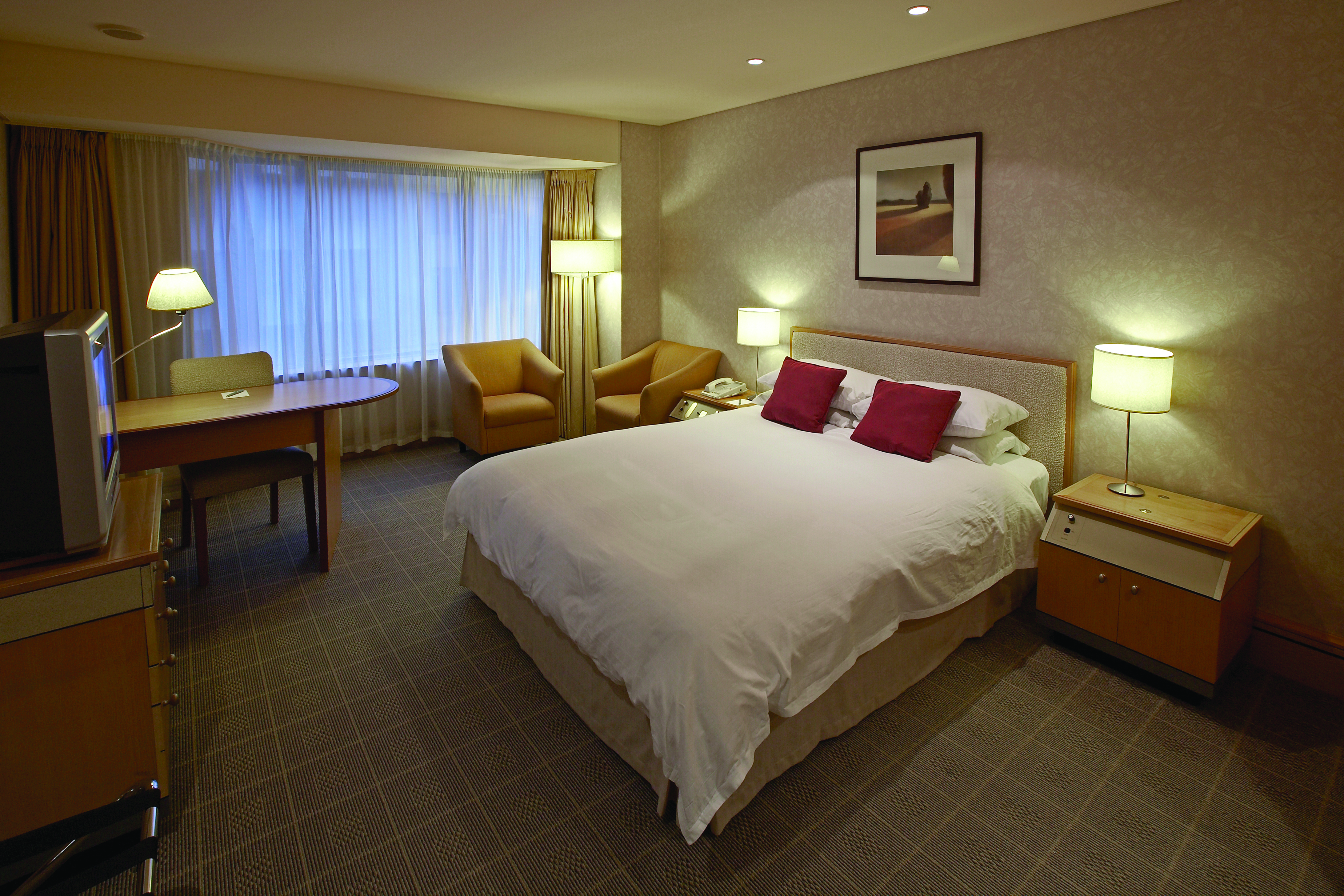 The Intercontinental Wellington standard bedroom with two armchairs and desk