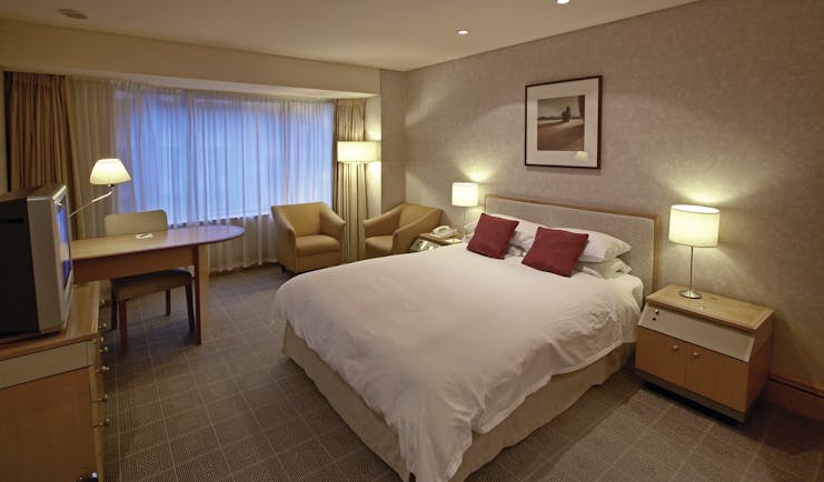 The Intercontinental Wellington standard bedroom with two armchairs and desk