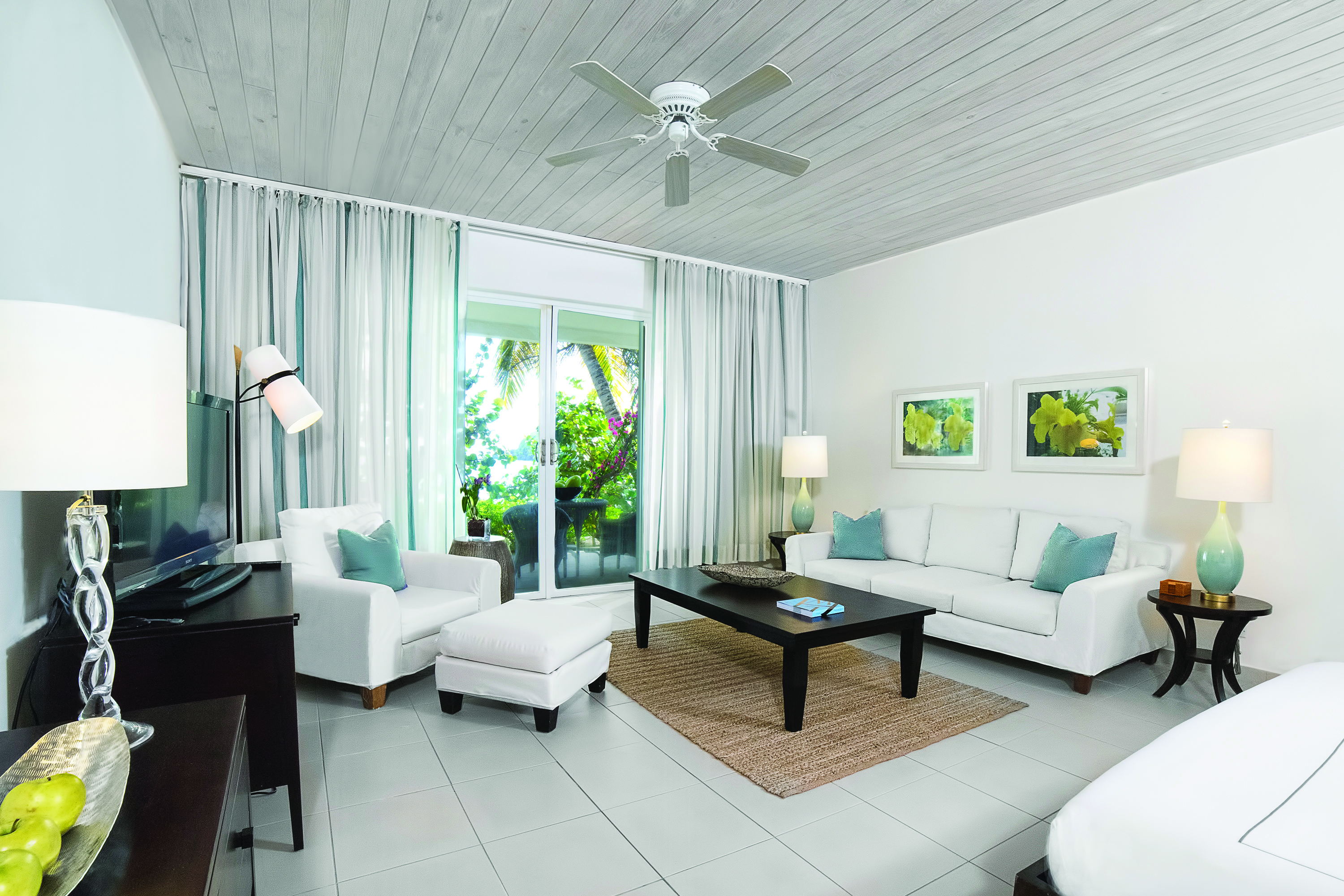 Carlisle Bay Antigua beach suite living room doors leading to terrace