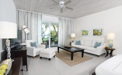 Carlisle Bay Antigua beach suite living room doors leading to terrace