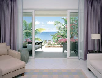 Carlisle Bay Antigua beach suite terrace sun loungers and ocean view