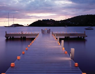Carlisle Bay Antigua candlelit dinner by night on jetty overlooking the ocean