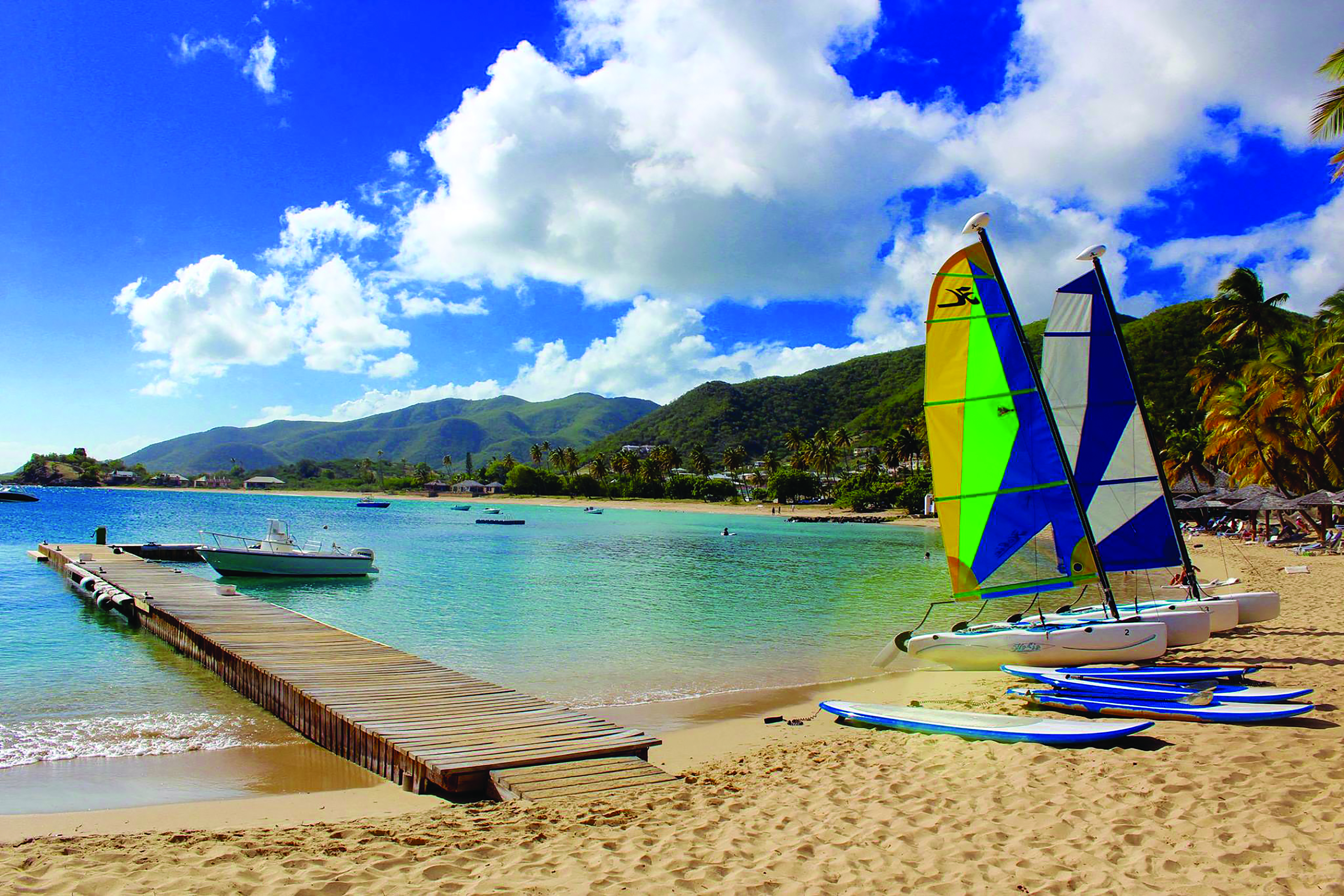 Curtain Bluff Antigua beach with surf boards and paddle boards