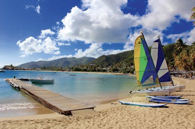 Curtain Bluff Antigua beach with surf boards and paddle boards