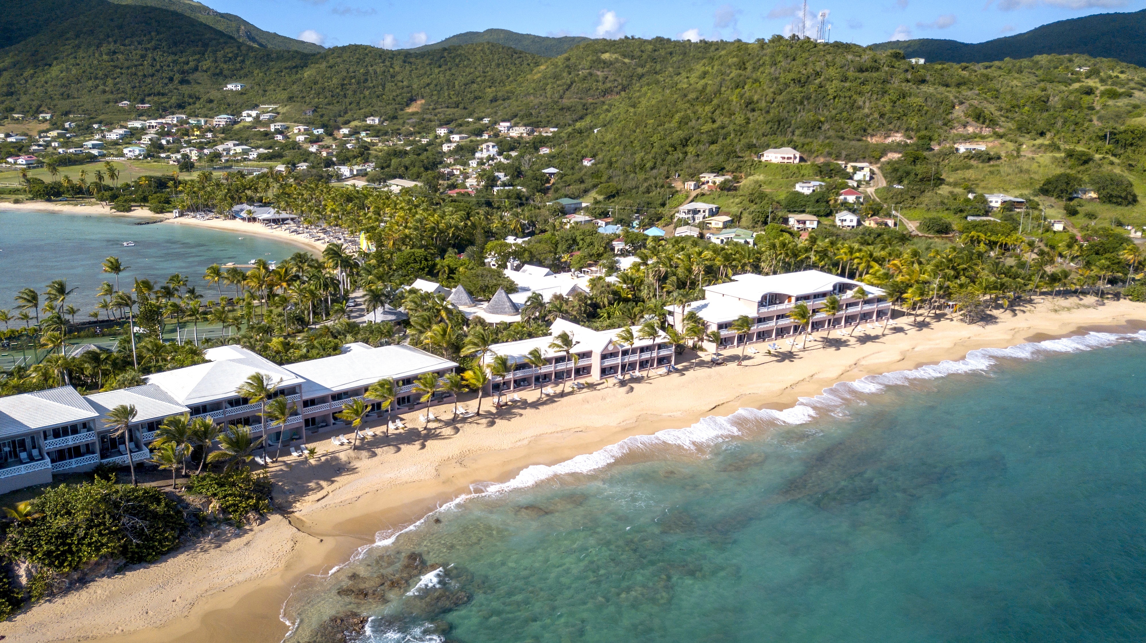 Sandy beach with hotel buildings alongside