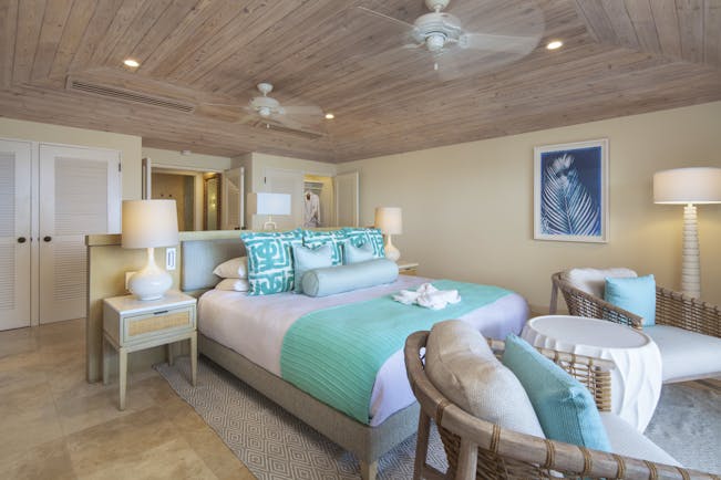 Bedroom with turquoise and white covers