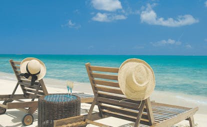 Galley Bay Antigua beach chairs white sand clear blue sea