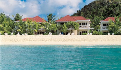 Galley Bay Antigua beach suites exterior buildings in background sea sandy beach