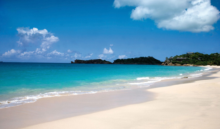 Galley Bay Antigua beach waves lapping on white sandy beach
