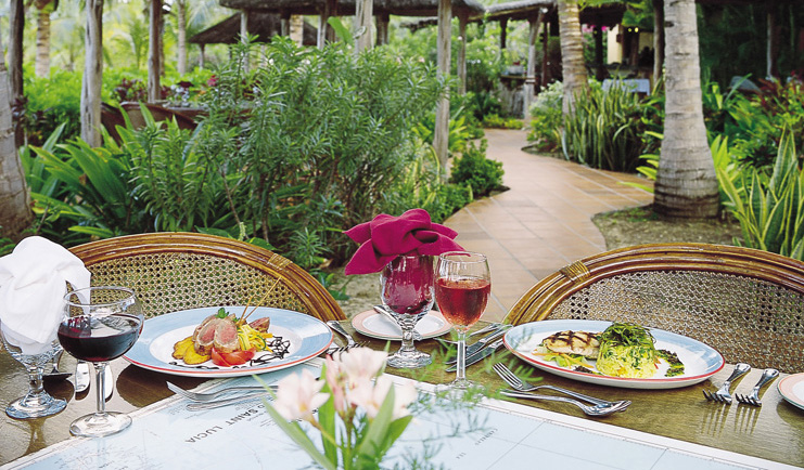 Galley Bay Antigua dining table wine plates of food