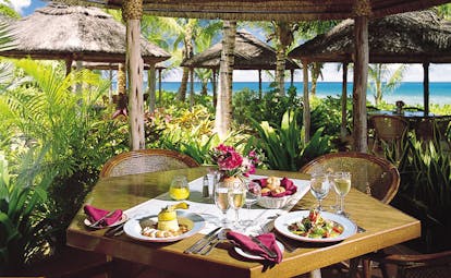 Galley Bay Antigua gauguin restaurant interior food on table surrounded by greenery