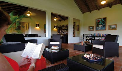 Galley Bay Antigua library woman reading communal indoor seating area modern décor