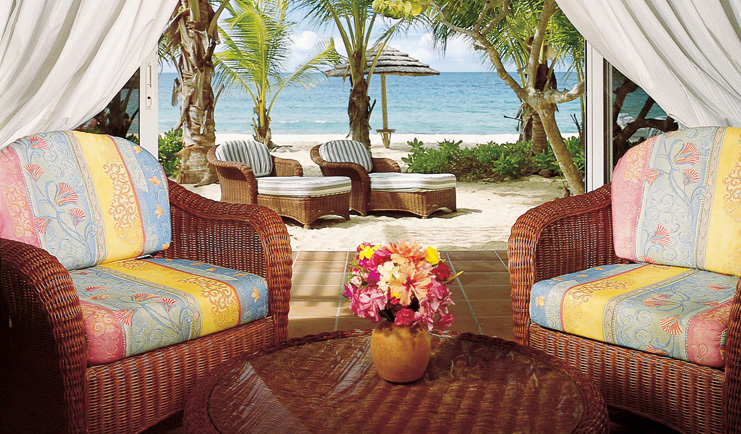 Galley Bay Antigua premium suite terrace armchairs leading to private beachfront terrace sun loungers