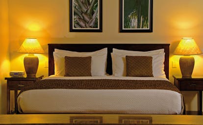 Galley Bay Antigua suite bedroom bed lamps modern décor