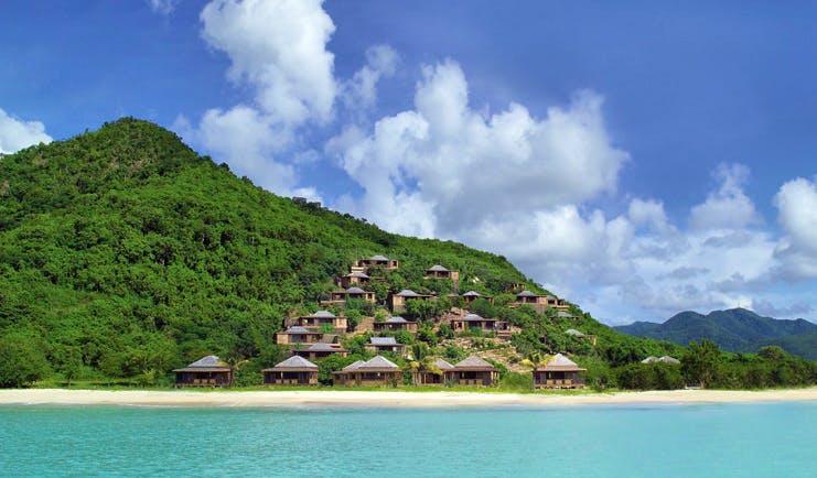 Hermitage Bay Antigua view of resort from sea beach cottages on the hillside