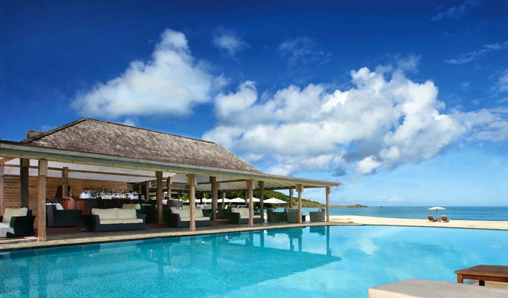 Hermitage Bay Antigua pool bar beach in background