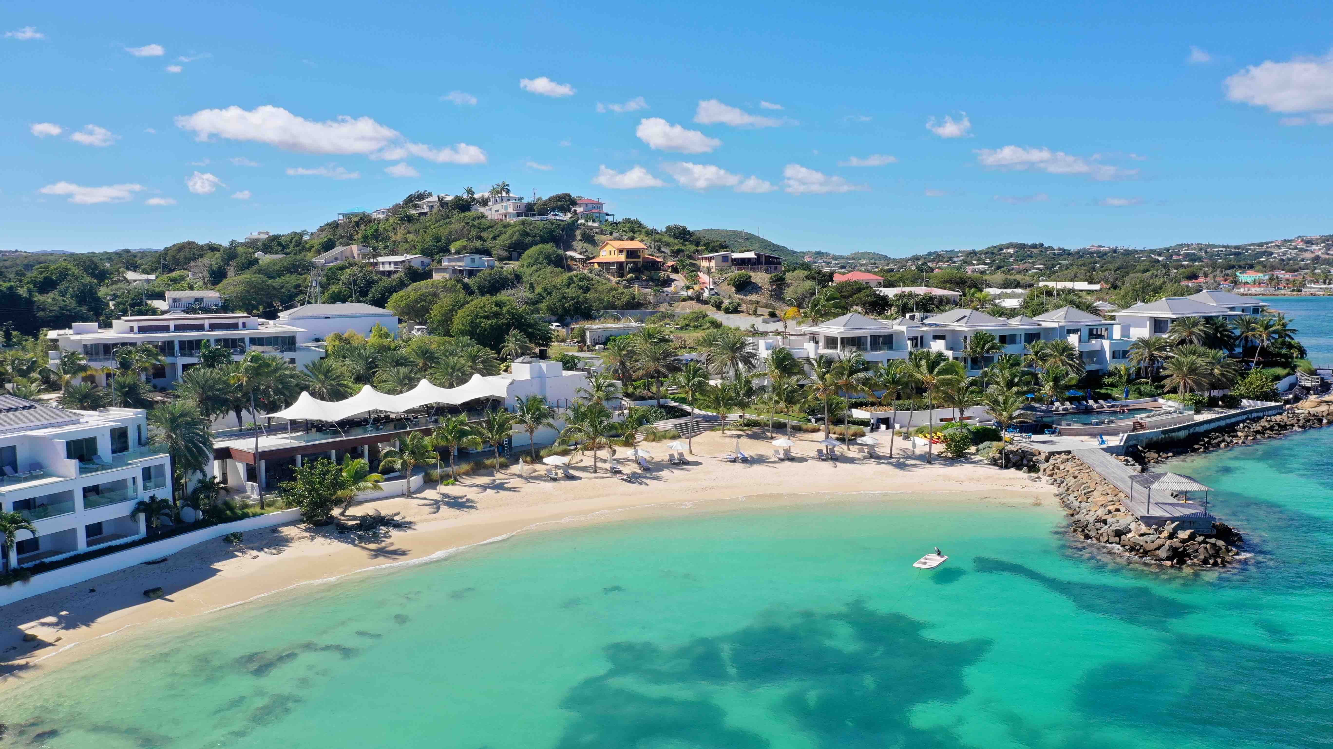 Aerial shot of Hodges Bay Resort, beach, white sand, hotel buildings