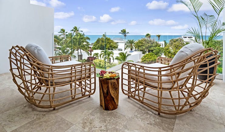 Hodges Bay Resort junior suite balcony, two armchairs, views overlooking the sea