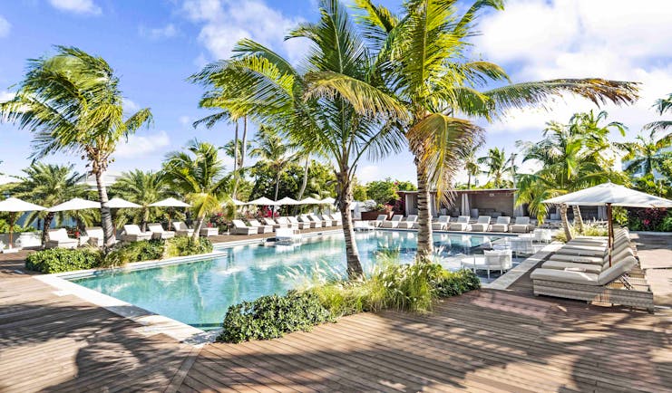 Hodges Bay Resort family pool, sun loungers, plam trees, decking